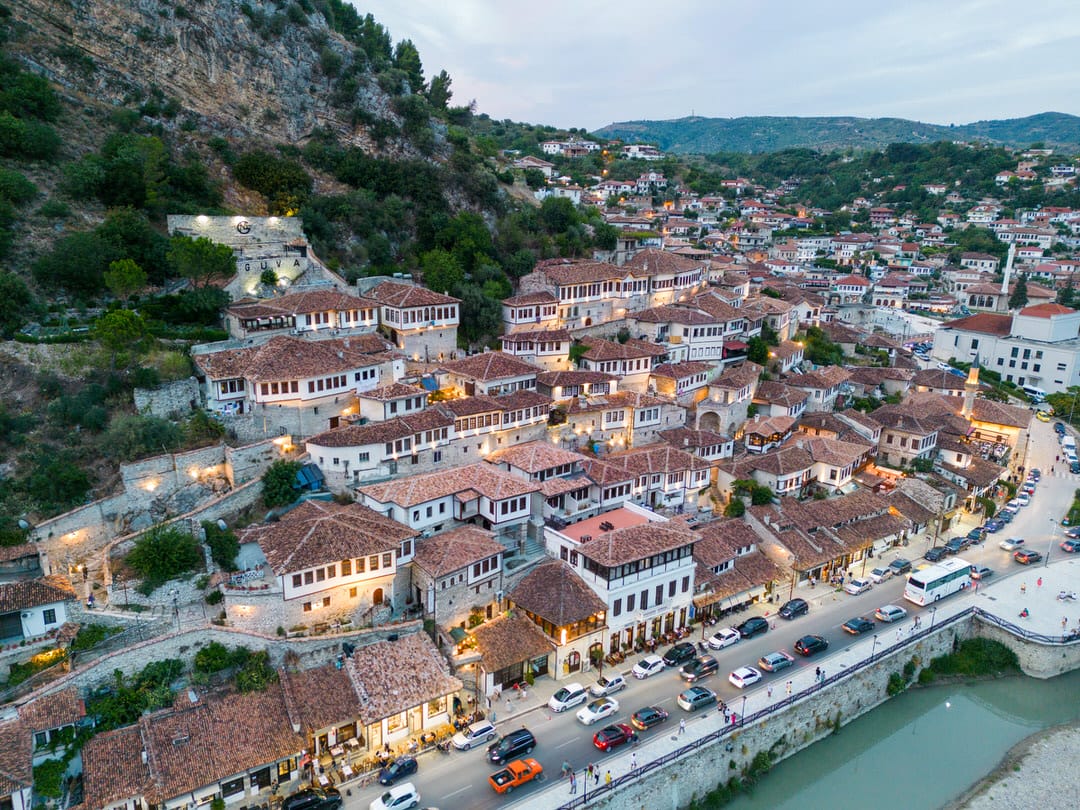 Mangalem neighbourhood in Berat, Albania — Ottoman houses and the river at dusk