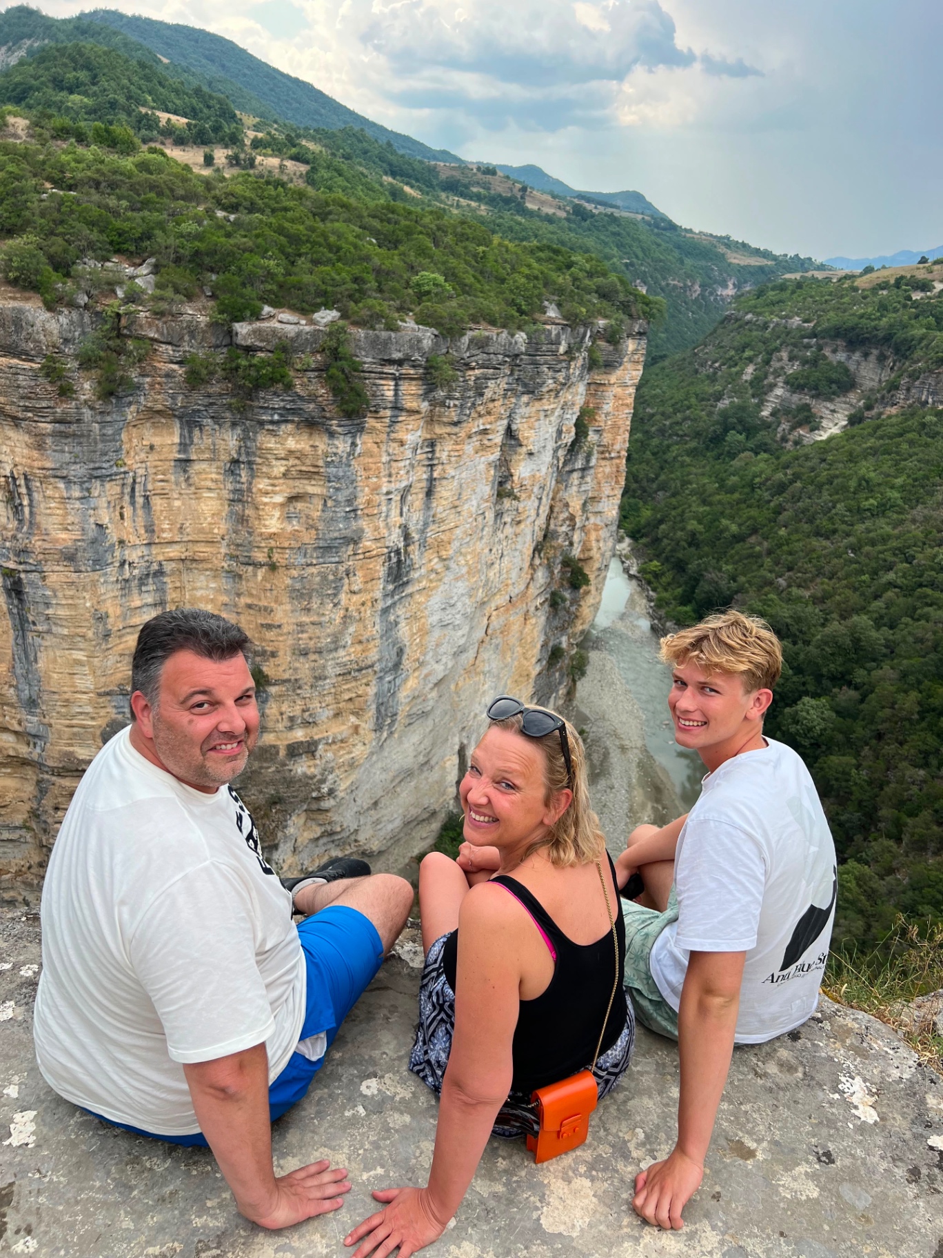 Family enjoying the cliffside view over the Osumi Canyon